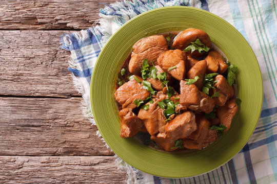 Chicken in Adobo sauce closeup on a plate. horizontal top view
