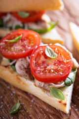 Grilled chicken sandwich with basil and tomatoes