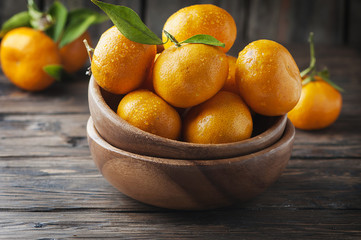Sweet orange mandarin on the wooden table