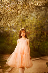 cute little girl in a spring garden