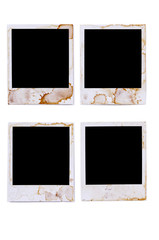 Four several old vintage stained damaged polaroid style blank photo print frame isolated on white background