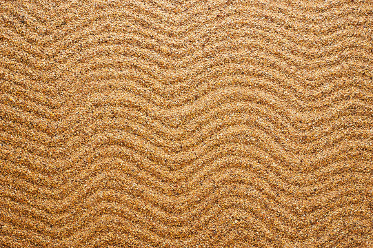 Background sand. Waves texture.