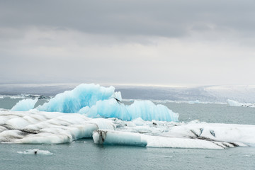 Glacial river lagoon.  Blue icebergs. Jokulsarlon glacier lake. Vatnajokull National Park. Iceland. August. © serg_did