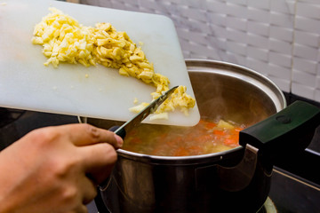 chef making soup