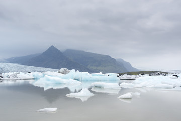 Glacial river lagoon.  Blue icebergs. Jokulsarlon glacier lake. Vatnajokull National Park. Iceland. August. © serg_did
