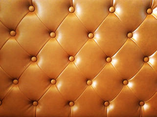 Upholstery brown leather for background.