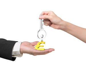Woman hand giving key pound symbol keyring to man hand