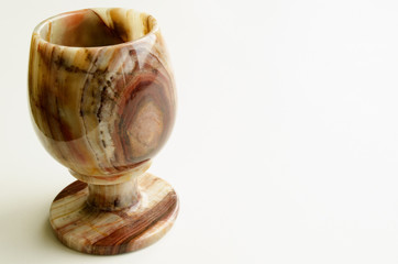 glass carved from onyx on a light background

