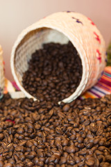 Close up of Brown Coffee Beans and White Wicker Bowl