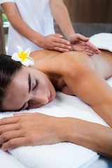 Fototapeta na wymiar Masseuse giving massage to relax woman at spa 