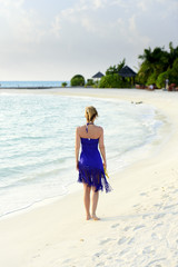 Fototapeta na wymiar Woman on luxury beach resort