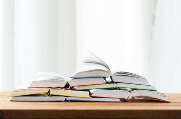 close up of books on wooden table
