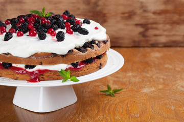 Mulberry and red currant cake with whipped cream