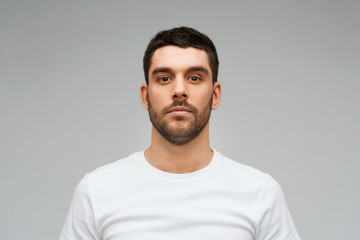 young man portrait over gray background