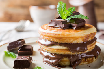 Homemade pancakes with chocolate spread. © Iryna Melnyk