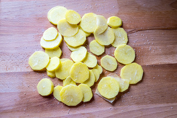 Sliced New Potatoes with Salt on a Cutting Board for Chips