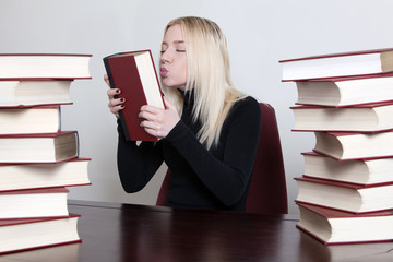 woman kissing a book