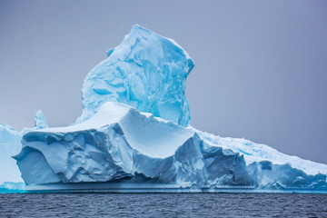 Part of the blue beautifull larger iceberg in ocean, Antarctica 