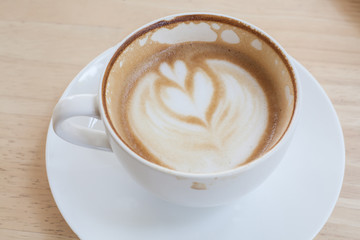 Latte Coffee art on the wooden table