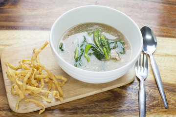 Fried noodle in Gravy on wooden background