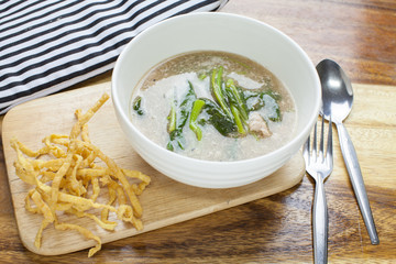 Fried noodle in Gravy on wooden background