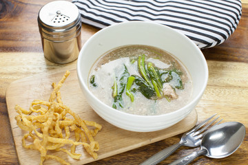 Fried noodle in Gravy on wooden background