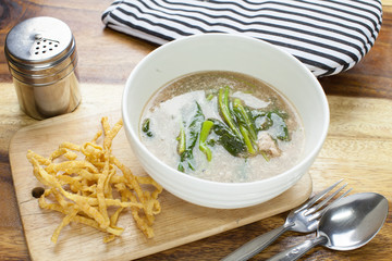 Fried noodle in Gravy on wooden background
