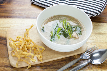 Fried noodle in Gravy on wooden background