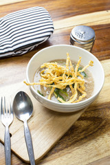 Fried noodle in Gravy on wooden background