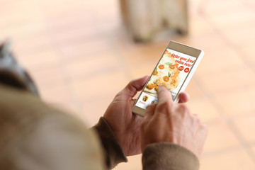 Brown young man smartphone order food