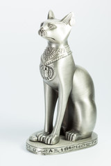 Obraz premium Metal Egyptian cat statue on white background