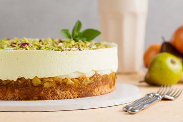 Pear and  pistachio mousse cake