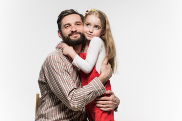 Girl hugging her father  over a white background