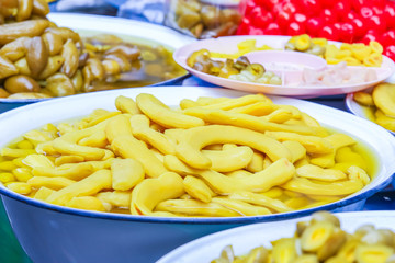 Thailand traditional pickled tamarind fruit at the vintage float market.