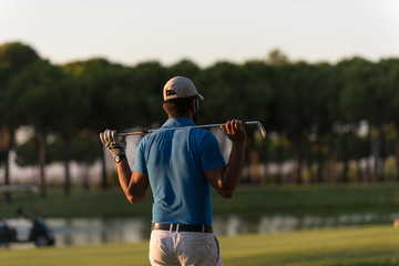 golfer from back at course looking to hole in distance