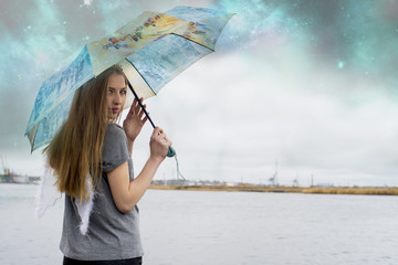 Woman with umbrella and wings,rainy day