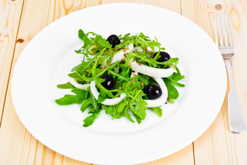 Arugula Salad with Squid, Flax Seeds, Olives and Cherry Tomatoes