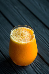 Fresh Orange Juice on Dark Wooden Background, Free Space for Text
