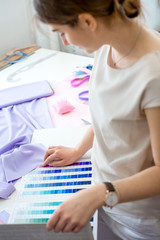 Obraz na płótnie Canvas tailors choose the fabric for the dress
