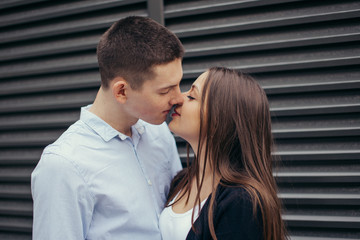 Lovely couple standing on the street and kissing