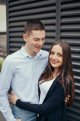 Lovely couple standing on the street and kissing