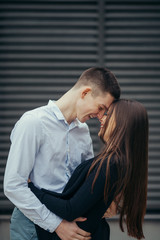 Lovely couple standing on the street and kissing