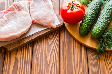 raw meat and vegetables with space for text