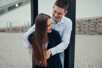 Lovely couple hugging on the street