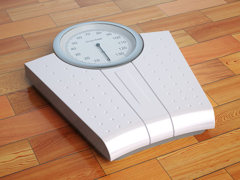 Scales on the wooden floor. Weight control.