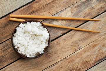 Bowl of rice and food sticks