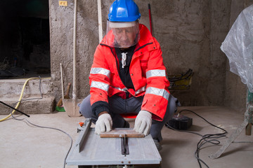 Fototapeta premium carpenter at work in a building site