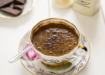 Black Coffee in Cup with Dark Chocolate Pieces