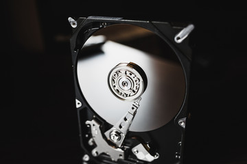 Disassembled hard drive from the computer (hdd) with mirror effects. Part of computer (pc, laptop)