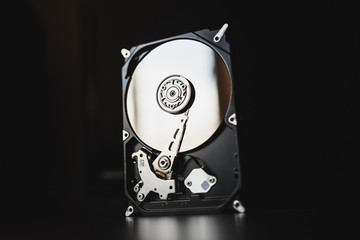 Disassembled hard drive from the computer (hdd) with mirror effects. Part of computer (pc, laptop)